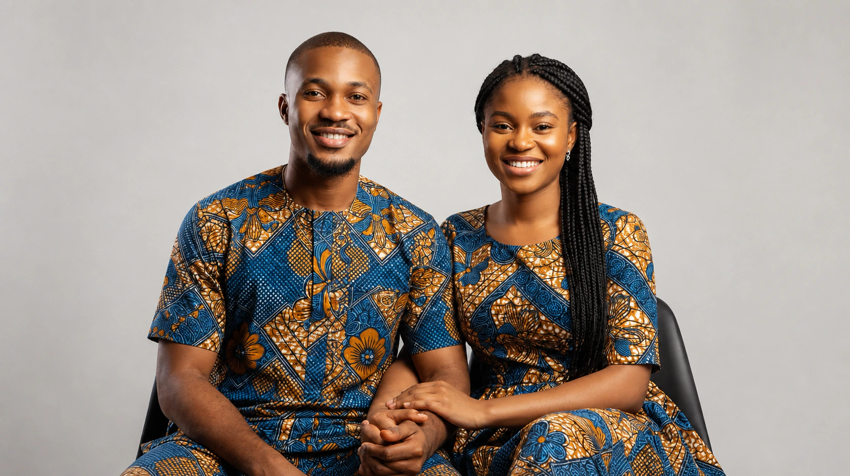 A smiling Nigerian couple sitting together