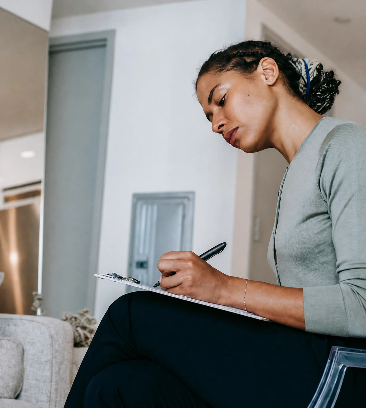 A practitioner taking notes during a learning session